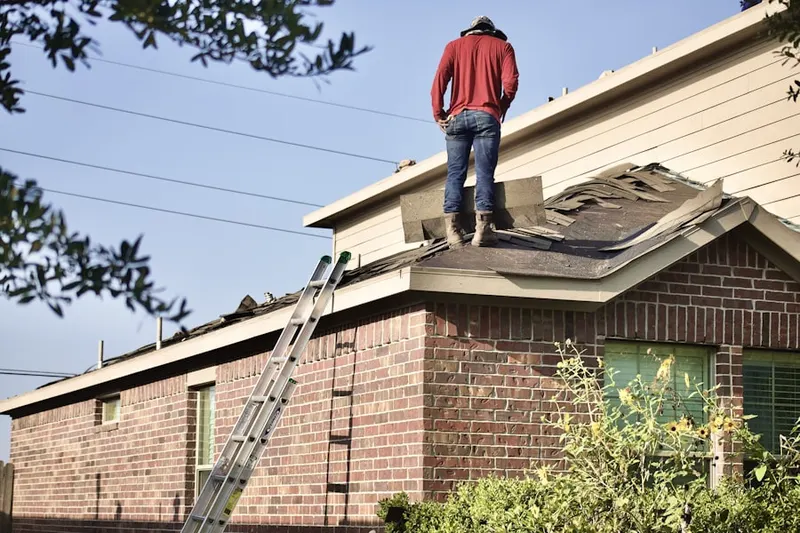 Professional roofer working on a residential roof in Downtown Santa Ana